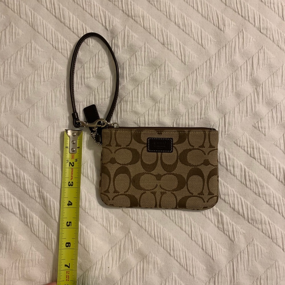 Small coach tan and brown wristlet.
